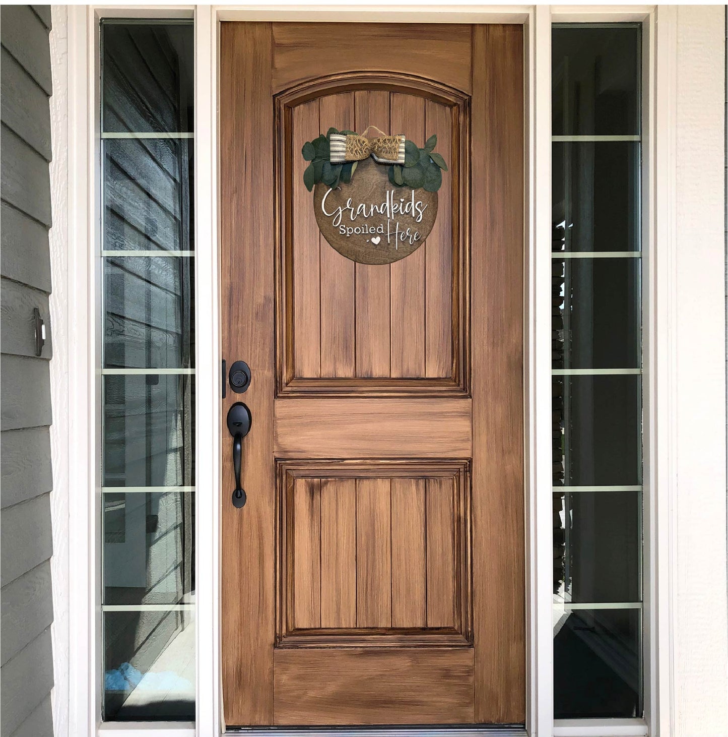 GrandKids Spoiled Here Door Sign